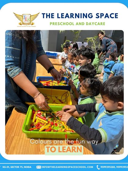 A teacher guides children in a Holi-themed sensory activity. Our educators ensure that all festival celebrations are inclusive, safe, and educational.