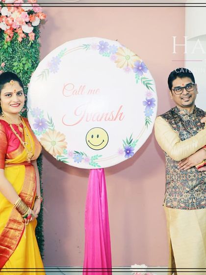 A proud family posing with their newborn and a custom name reveal sign. These signs make for a perfect photo opportunity to cherish forever.