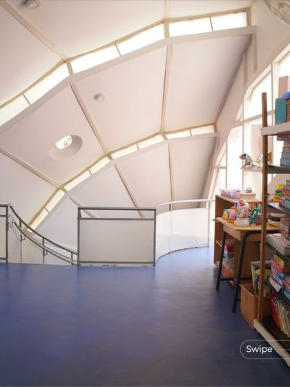 Another view of the open and airy interior of the kindergarten block. The lack of columns creates a large, uninterrupted space for play and learning.