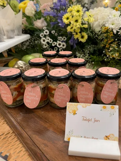 Our 'Talafet Jars', a layered salad or dip served in individual jars. This is a modern and convenient way to serve complex dishes at a standing event.