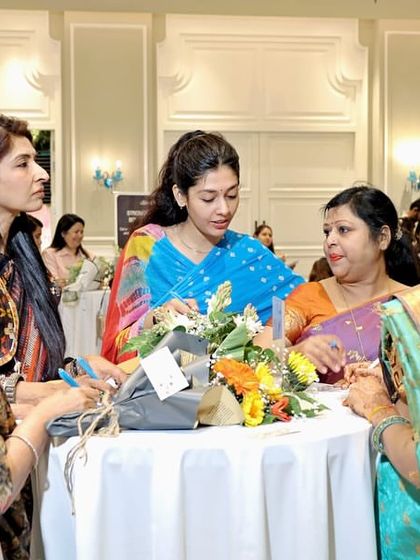 Guests mingling and enjoying the activities at my Mother's Day celebration. I design my events to foster interaction and create a warm, welcoming atmosphere where everyone can relax and connect.