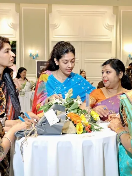 Guests mingling and enjoying the activities at my Mother's Day celebration. I design my events to foster interaction and create a warm, welcoming atmosphere where everyone can relax and connect.