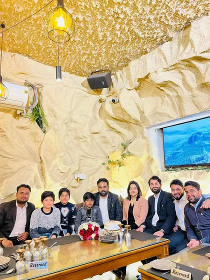 A birthday dinner with my mentor, his family, and our team. We are more than just colleagues; we are a professional family.