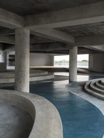The informal seating area in the MSAP courtyard, with its curving concrete forms, provides a space for students to gather, relax, and exchange ideas.