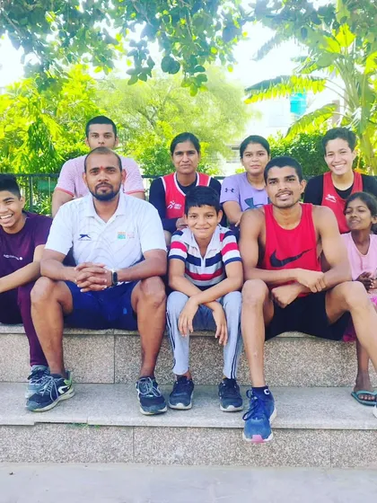 A moment of rest with the team after a tough morning training session. The smiles show the sense of accomplishment and camaraderie we share.