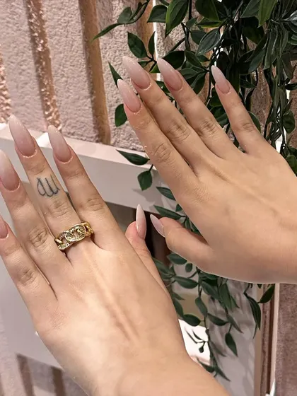Another view of these beautiful, long ombré nails, showing how they complement the client's personal style.