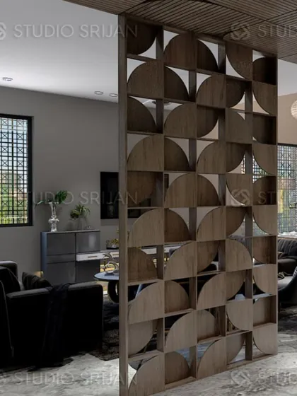 A geometric wooden partition screen artfully divides the space in this Varanasi home, adding a decorative element while maintaining an open feel.