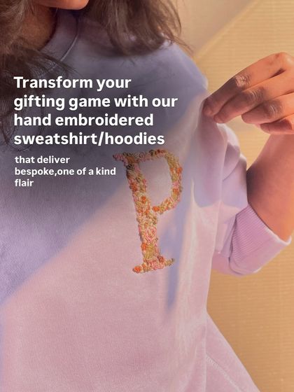 Transform your gifting game with a one-of-a-kind hand-embroidered sweatshirt, like this beautiful floral 'P' design.