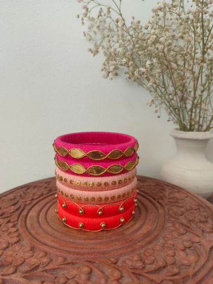 A beautiful set of bangles in shades of pink and red. I used different techniques here, including gota patti and simple beadwork, to create a varied and interesting stack.