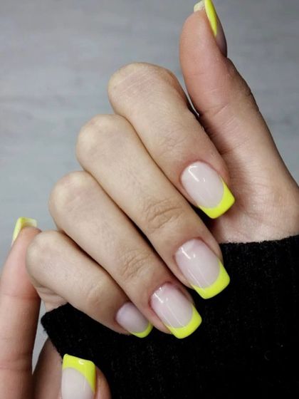 Square-tipped French manicure with a pop of bright yellow. This is a great way to add a touch of color while keeping the look clean and classic.