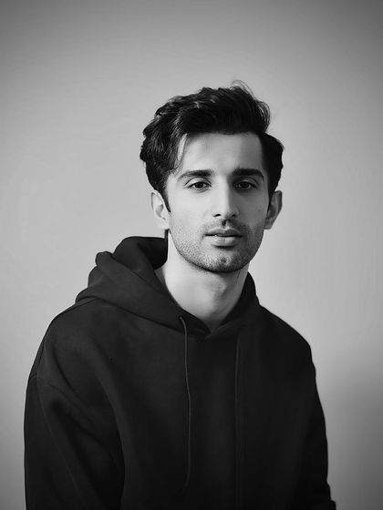 Another portrait of Sidhant, highlighting the versatility of his hair, styled here with a bit more volume and texture.