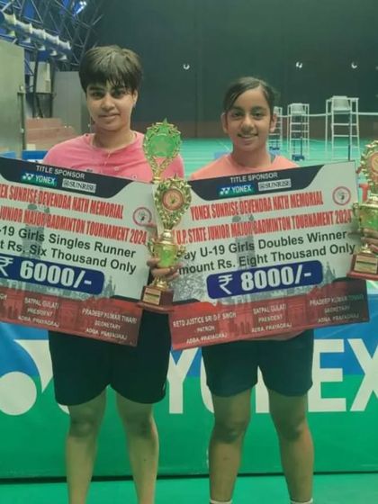 **U.P. Major U-19 Girls' Doubles Champions.** Ridhima Singh and Divyanshi Gautam with their trophies and prize money after winning the U-19 Girls' Doubles title.