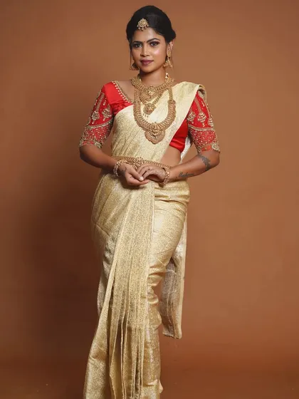 A full-length view of the bride, showing how the jewellery complements her entire outfit.