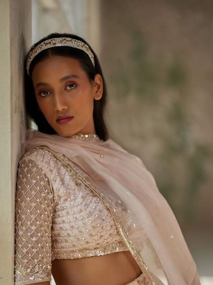 A beautiful shot of a model wearing our beaded hairband, perfect for a sophisticated look.