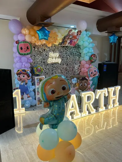 The Cocomelon setup with a focus on the main character balloon, showing how these large foils can be a great centerpiece.
