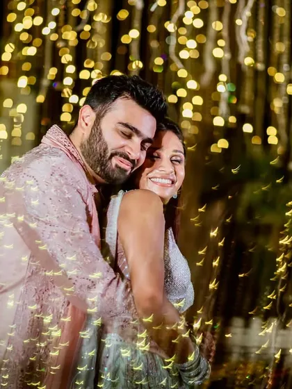 We always find a few minutes to sneak away and create some magic. Using creative lighting techniques like this slow shutter drag, I can turn a simple moment of embrace into a piece of art that sparkles with love and light.
