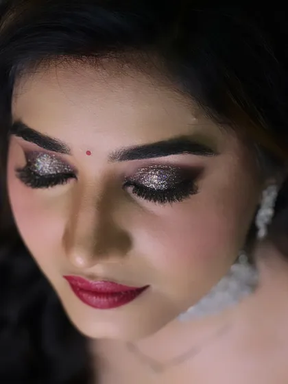 A close up of the perfect features of my reception bride. The glittery smokey eye is the star of this look.