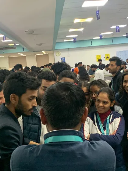 A wide shot of the crowd that gathers during a roving performance in a corporate space. My act naturally draws people in, creating a buzz of excitement.