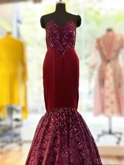 I also create statement gowns for red-carpet-worthy moments. This customized ball gown features a sweetheart neckline and a dramatic sequined mermaid-style skirt, with a corset bodice that ensures a perfect fit for a glamorous reception or engagement party.