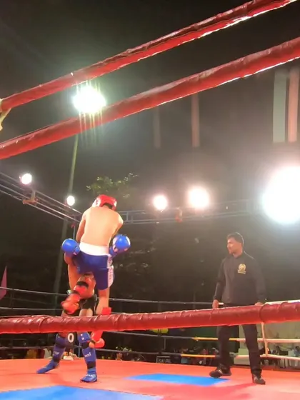 A sweep attempt during the K1 fight, showing the blend of techniques used in modern kickboxing.
