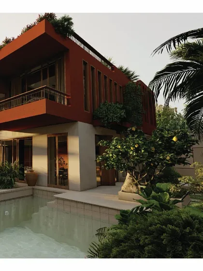 Another view of the 'Red Haus', showcasing its bold red forms against the lush green landscape and private pool. The design emphasizes a strong connection to the outdoors, with large openings and natural materials.