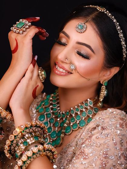 A close-up of the Sangeet look, showing the sparkling eye makeup and the joyful expression.