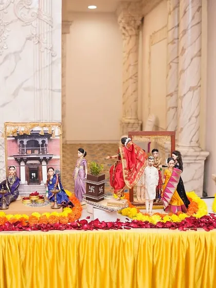 A wide view of one of our complete 'Dohale Jevan' or baby shower rukhwat displays. We arrange multiple themed scenes, from a traditional 'wada' setting to a depiction of the mother-to-be, creating a beautiful and meaningful centerpiece for the celebration.