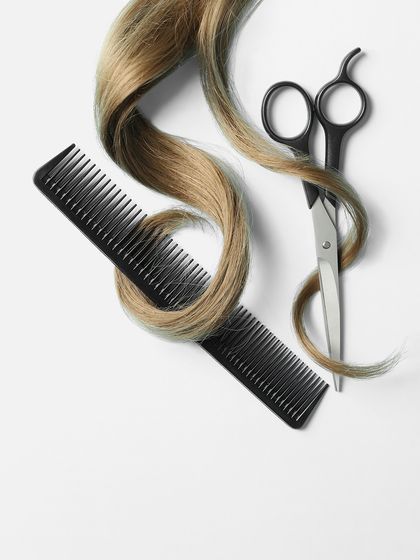 The essential tools of our craft. A comb and professional shears represent the artistry and precision that go into every haircut at our salon.