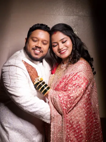 An intimate portrait of the couple. The bride's soft glam makeup, with shimmering eyeshadow and a warm lip color, looks stunning in her reception photos.