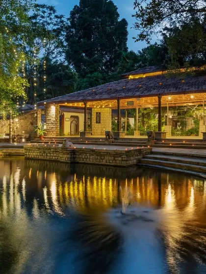 As evening falls, the Pond Pavilion transforms. The warm lights create a magical reflection in the water, offering a truly enchanting atmosphere for any event.