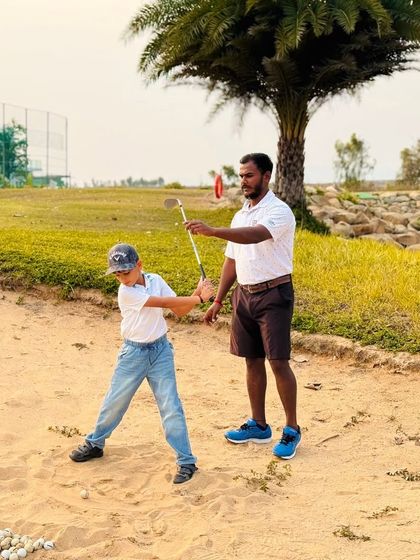 Coach Kiran provides hands-on instruction in the bunker. He is a mentor who is dedicated to helping his students master every part of the game.