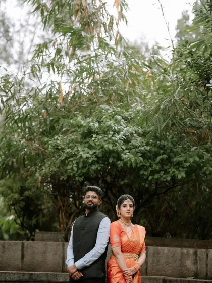 A classic outdoor portrait of the couple. The natural setting and their formal attire create a beautiful juxtaposition.