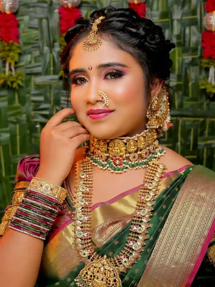 A close-up of a classic South Indian Muhurtham makeup look. I focus on enhancing your features to create a radiant and timeless appearance that complements the heavy temple jewelry and silk saree.