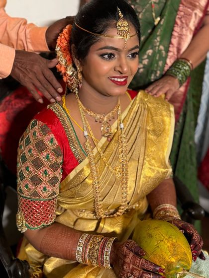 A close-up of the bride during her ceremony. The makeup is designed to look flawless from every angle, highlighting her features while maintaining a classic, timeless feel.