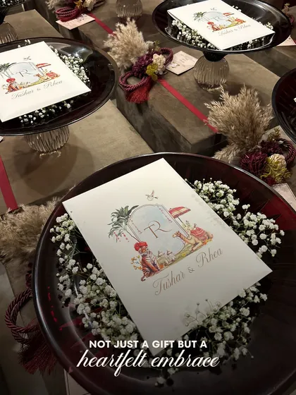 "Not just a gift but a heartfelt embrace." Our Crimson Crystal Bowls are presented here as elegant wedding favors, each with a personalized card, resting on a bed of baby's breath.