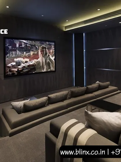 In this design, we used dark, textured wall panels and a long, comfortable sofa to create an intimate yet powerful home cinema. The large screen is the centerpiece, delivering a high-impact visual experience for movies, sports, and gaming.