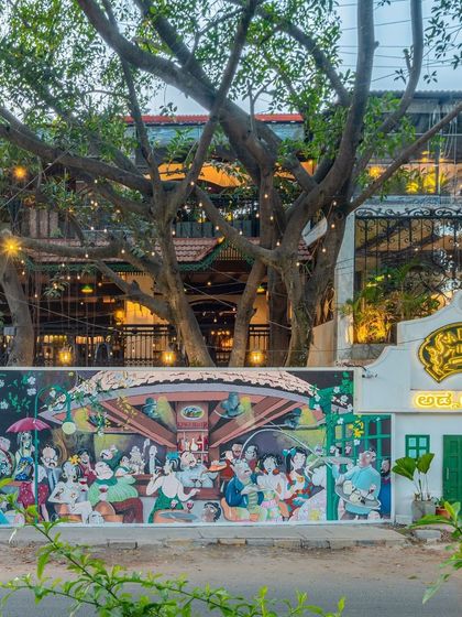 We were honored to recreate a famous illustration of old Bangalore for Adda 1522. This exterior mural not only beautifies the entrance but also connects the establishment to the city's rich history, creating a powerful sense of place.
