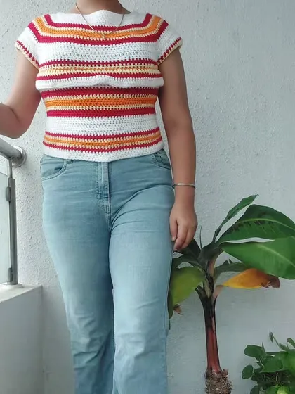 A full-body shot of the Woolie Top styled with jeans for a casual, chic look.