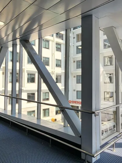 An interior view from the skybridge connecting the two blocks of Venkateshwar Hospital. Executing this large-span structure required precise structural engineering and project management to ensure a safe and functional link between the buildings.