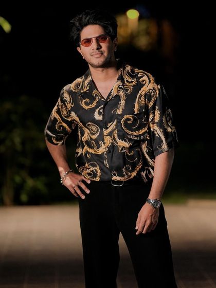 The full look. The iconic Versace print gives this outfit a dose of high-fashion energy, perfect for a promotional event.