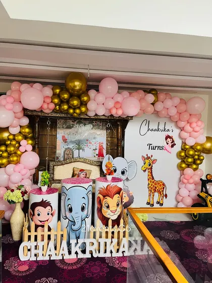A full view of the pink and gold jungle theme, perfect for a little girl's first birthday.