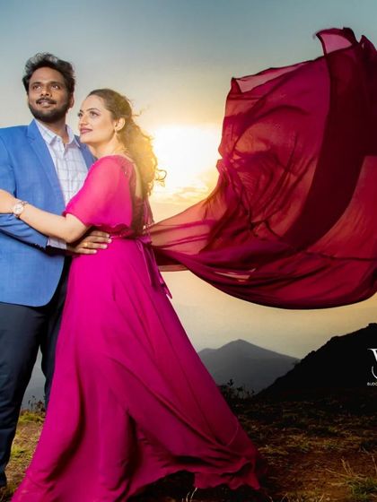 The setting sun provides a golden glow for this romantic pre-wedding portrait. The magenta flying gown adds a beautiful splash of color to the scene.