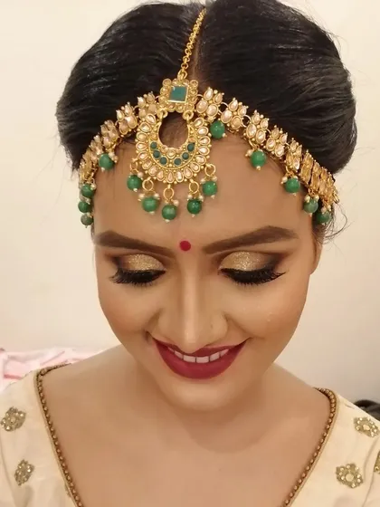 A close up of the golden eye makeup from the previous look. The shimmer on the lids catches the light beautifully, creating a soft yet glamorous effect.