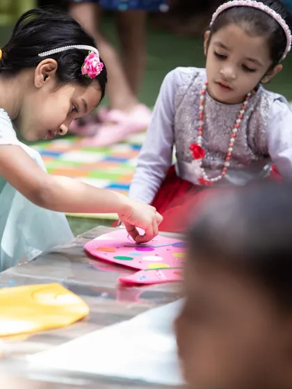 It's all about hands-on fun! Here, young guests are focused on a creative craft activity, a key part of my parties that encourages imagination and gives them a wonderful handmade souvenir to take home.