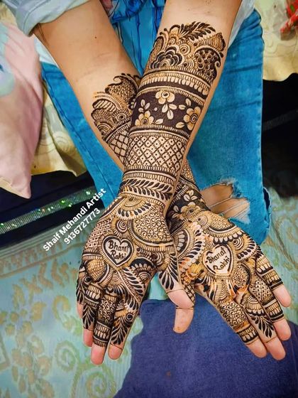 A creative design for Raksha Bandhan, with 'Bharat Rakhi' written inside hearts on both palms. Mehandi is perfect for all festive occasions.