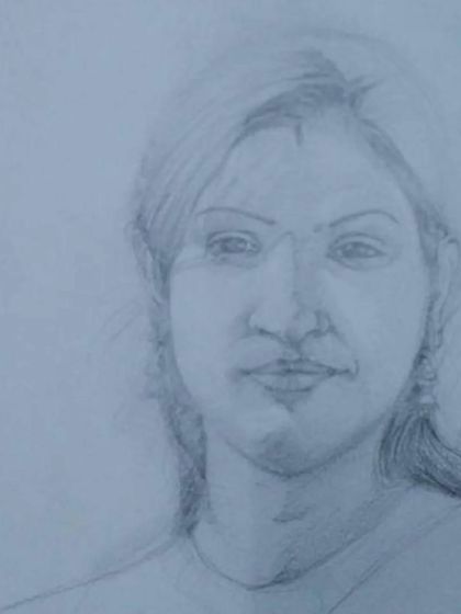 An unfinished portrait sketch, showing the initial stages of building up form and shadow. Our classes break down the process so that even beginners can learn to draw realistic portraits.