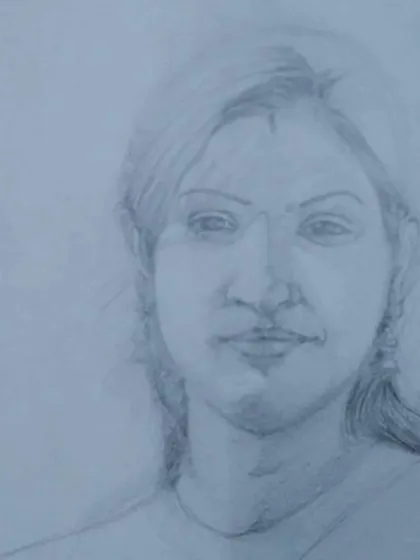An unfinished portrait sketch, showing the initial stages of building up form and shadow. Our classes break down the process so that even beginners can learn to draw realistic portraits.
