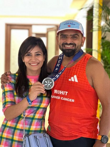 Posing with a fellow runner and his Chicago Marathon finisher medal in Delhi. The marathon community is global, and it's always inspiring to connect with others who have chased the same dreams.