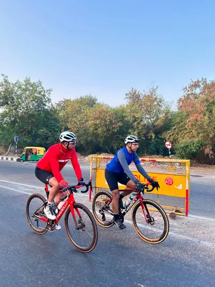 Two riders navigating a turn together.