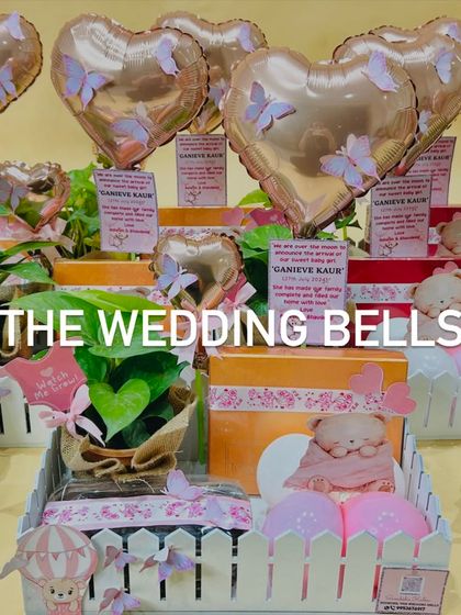 A beautiful setup of our birth announcement hampers for baby Ganieve. Each hamper includes a plant, a sweet box, and a personalized balloon.